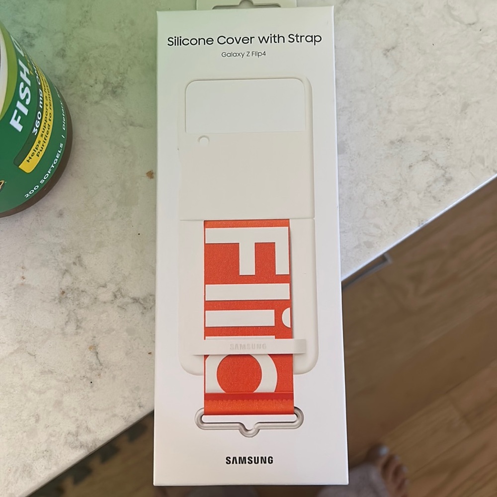 Silicone cover with strap color white .